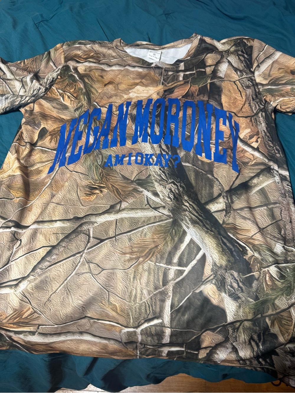 Megan Moroney dri fit tops . Size XL only only .Camouflage Top with Blue Graphic